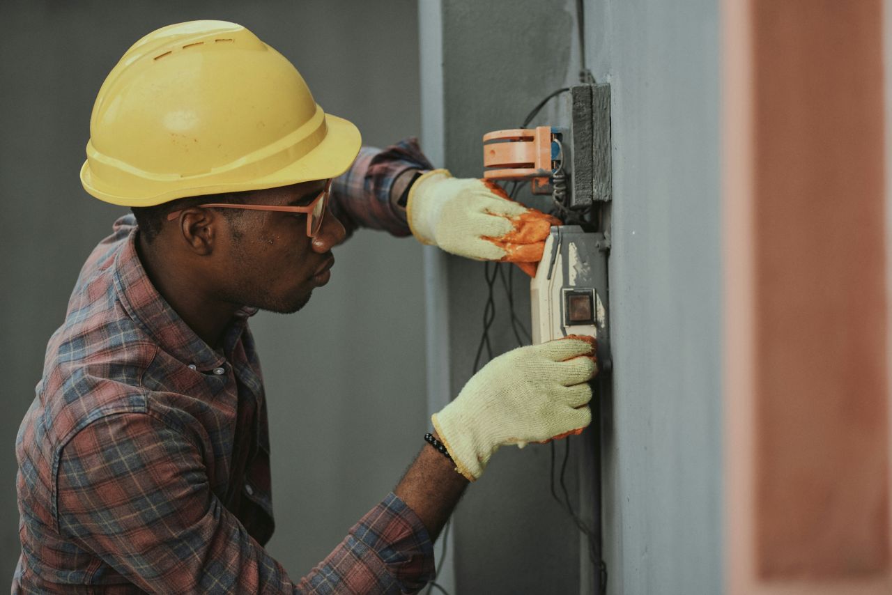 Electrician working on a wall switch